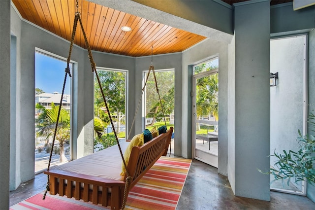 sunroom / solarium featuring wood ceiling