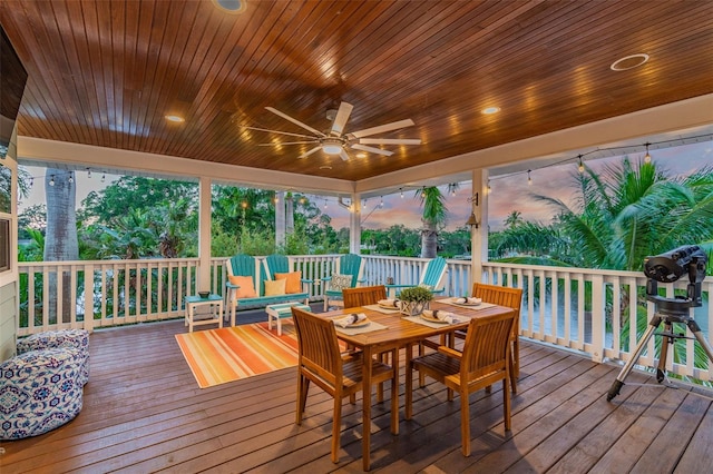 deck at dusk with ceiling fan