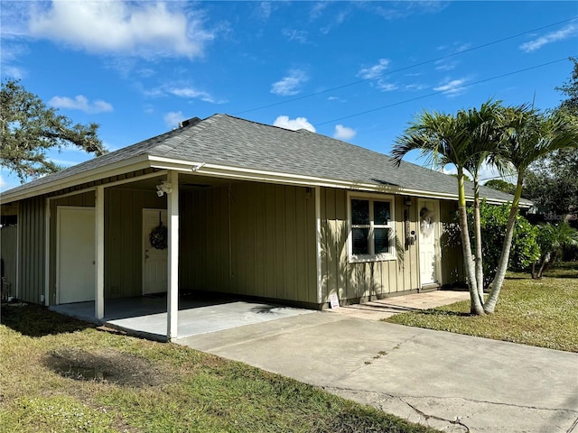 rear view of house with a yard