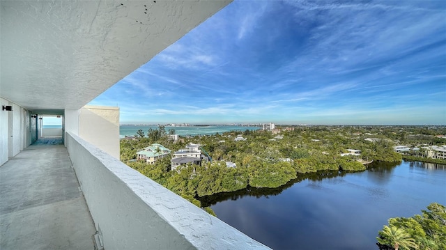 balcony featuring a water view