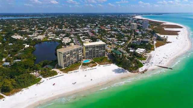 aerial view with a water view and a view of the beach