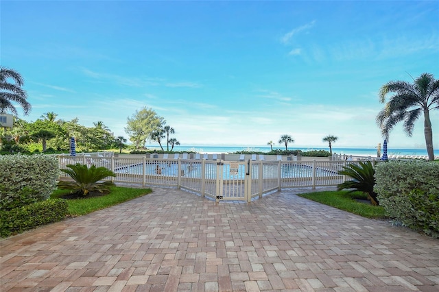 view of swimming pool featuring a water view