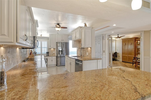 kitchen featuring white cabinetry, sink, and stainless steel appliances