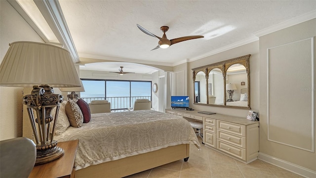 tiled bedroom with crown molding, built in desk, a textured ceiling, access to outside, and ceiling fan