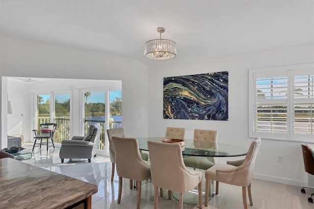 dining space featuring a notable chandelier