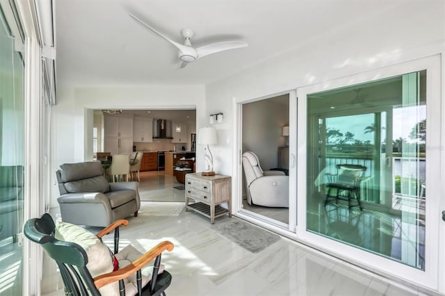 interior space with ceiling fan