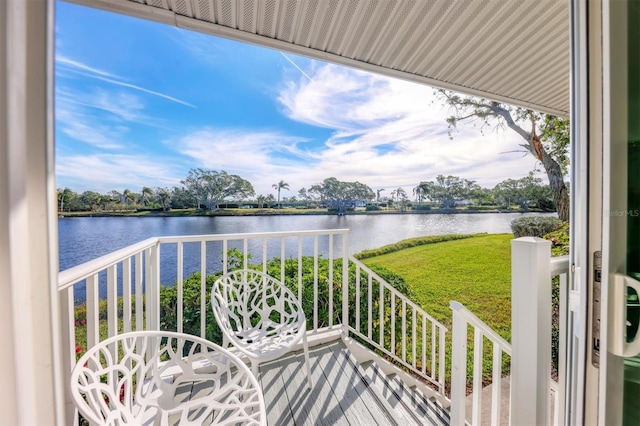 balcony featuring a water view