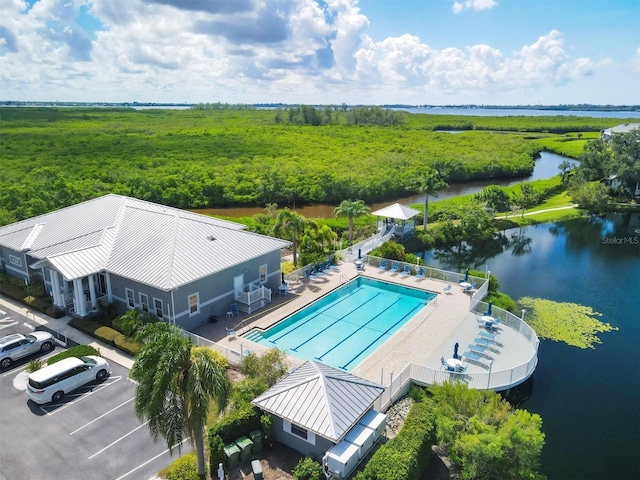 birds eye view of property featuring a water view