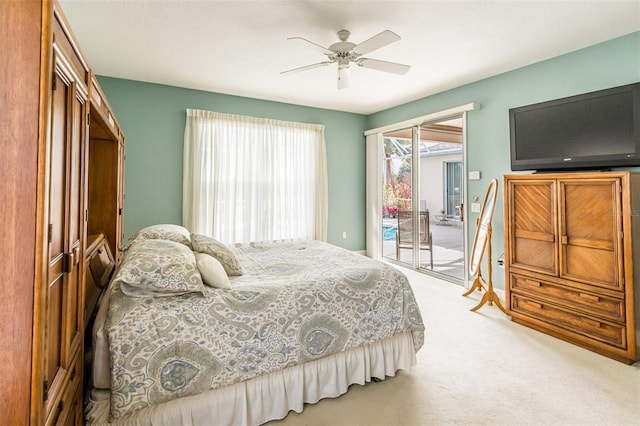 bedroom featuring access to exterior, ceiling fan, and light colored carpet