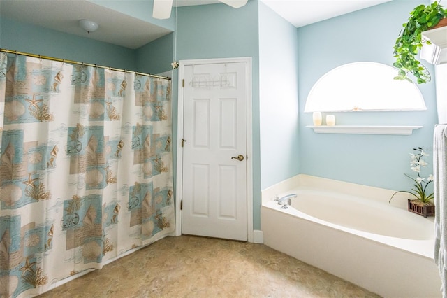 bathroom featuring curtained shower and a bath