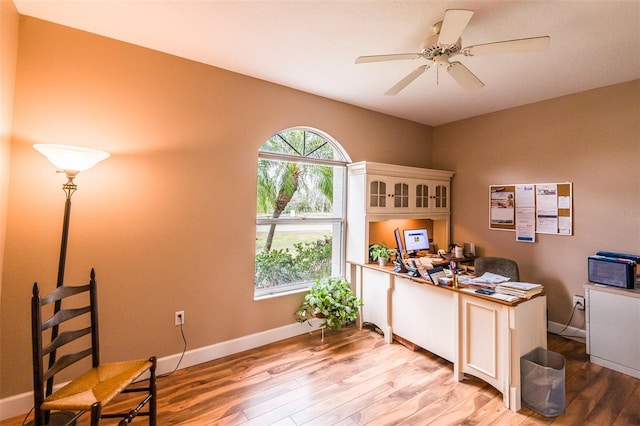 office area with ceiling fan, light wood-style flooring, and baseboards