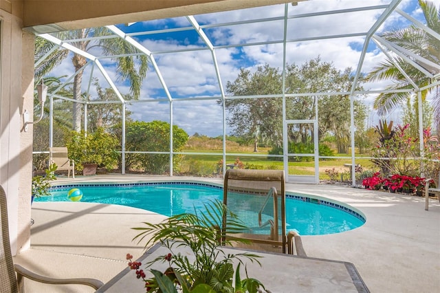 pool featuring a lanai and a patio area