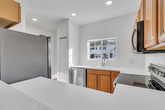 kitchen featuring appliances with stainless steel finishes and sink