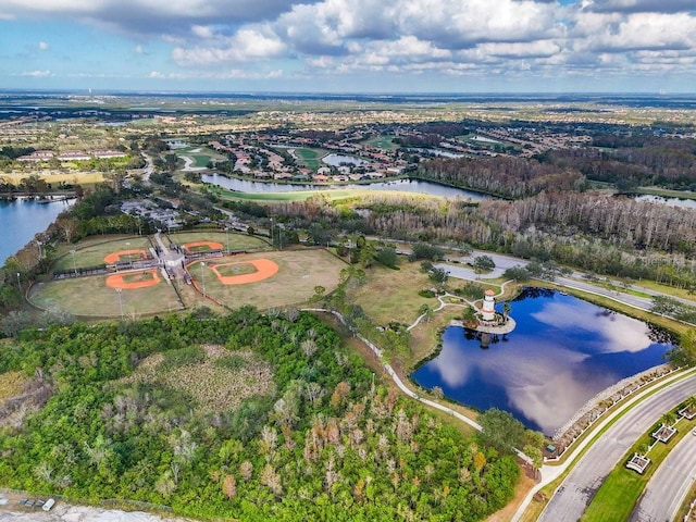 birds eye view of property with a water view