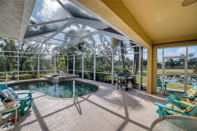 view of swimming pool featuring an in ground hot tub, a patio, a water view, and glass enclosure