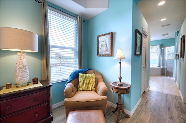 sitting room featuring light hardwood / wood-style flooring