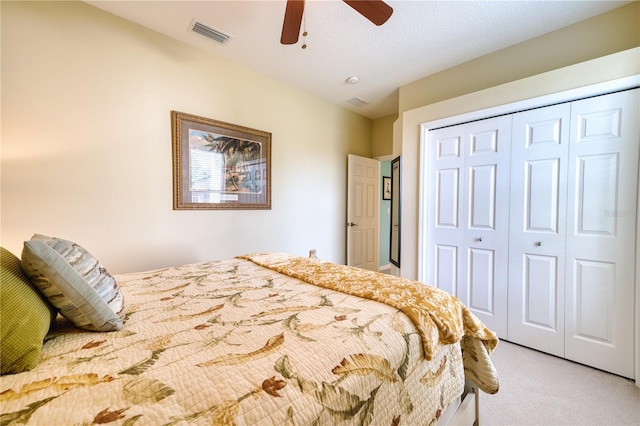 9351 Raes Creek Pl, Palmetto, FL 34221 - bedroom featuring carpet, a closet, and ceiling fan
