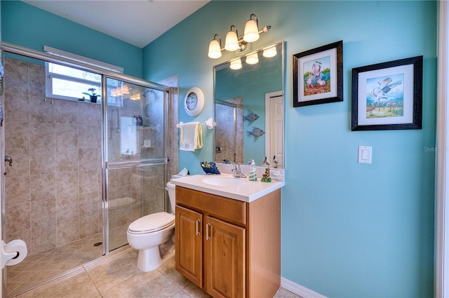 bathroom with tile patterned flooring, vanity, toilet, and an enclosed shower