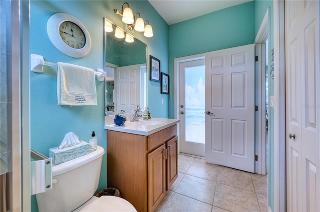 bathroom featuring tile patterned floors, vanity, and toilet