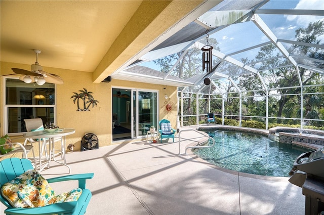 view of pool featuring a lanai, an in ground hot tub, ceiling fan, and a patio