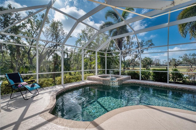 view of swimming pool featuring a lanai, an in ground hot tub, and a patio