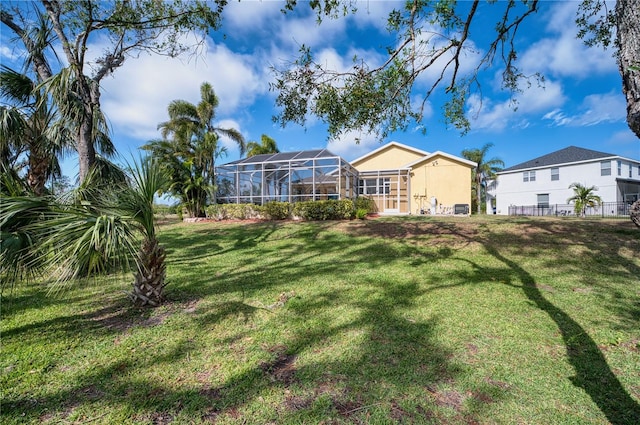 view of yard featuring a lanai