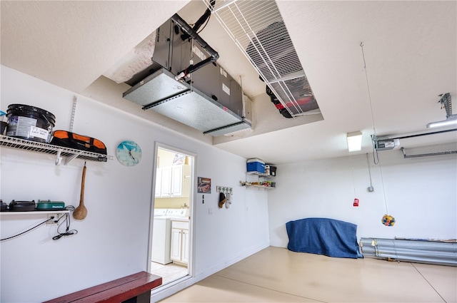 garage with washer and clothes dryer