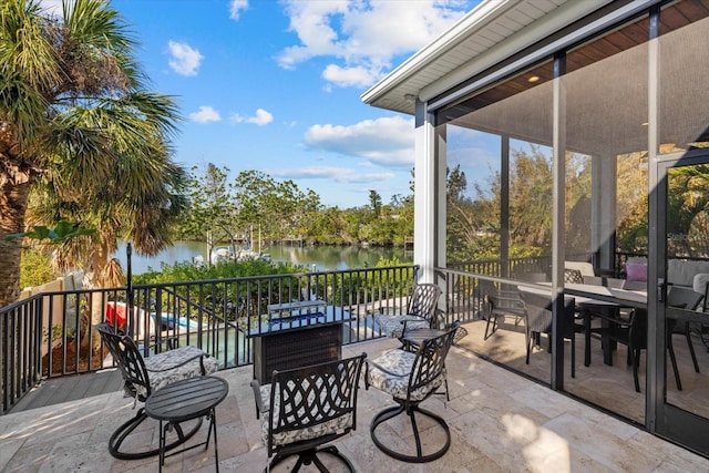 view of patio with a water view