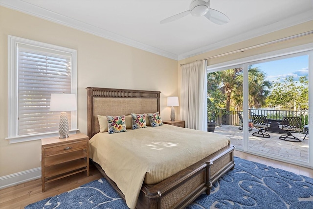 bedroom featuring hardwood / wood-style flooring, ceiling fan, ornamental molding, and access to outside