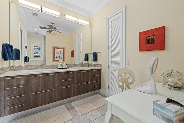 bathroom with backsplash, crown molding, tile patterned flooring, and vanity