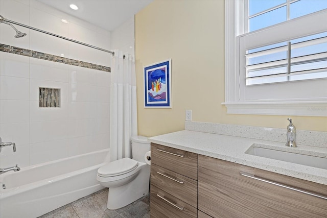 full bathroom with tile patterned floors, vanity, shower / tub combo, and toilet