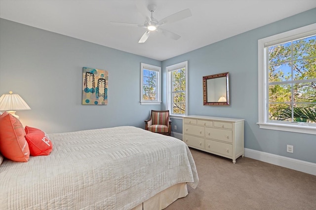 bedroom featuring ceiling fan and light carpet