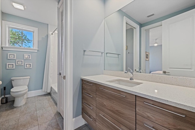 full bathroom with vanity, toilet, ceiling fan, and shower / bath combo with shower curtain