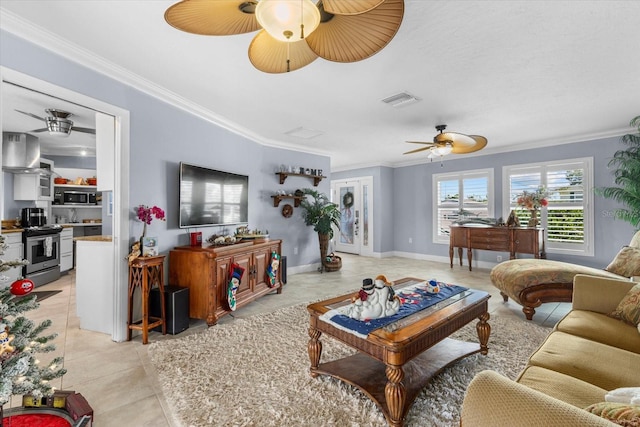 living room with light tile patterned floors and ornamental molding