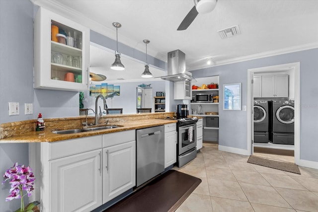 kitchen with island exhaust hood, stainless steel appliances, sink, pendant lighting, and white cabinetry