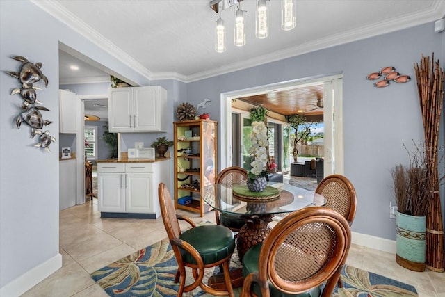 dining space featuring light tile patterned floors and ornamental molding