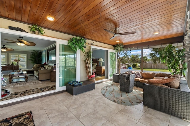 view of patio with outdoor lounge area and ceiling fan