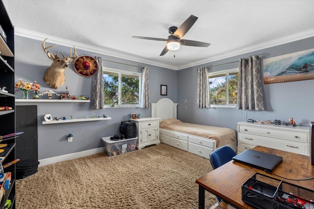 carpeted bedroom with ceiling fan and ornamental molding