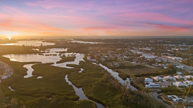 aerial view at dusk with a water view