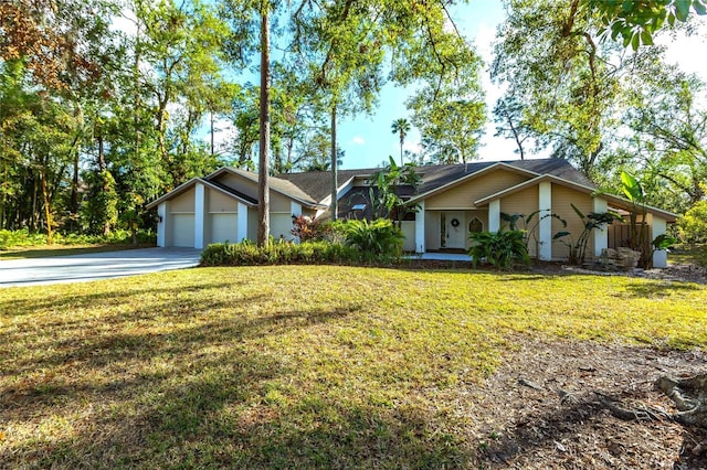 single story home featuring a front lawn and a garage