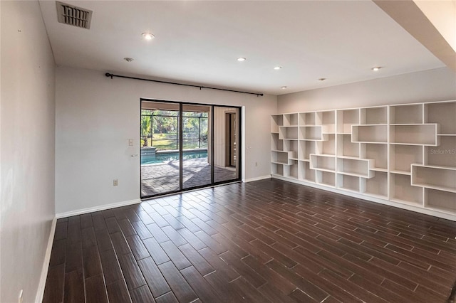 spare room with dark hardwood / wood-style floors