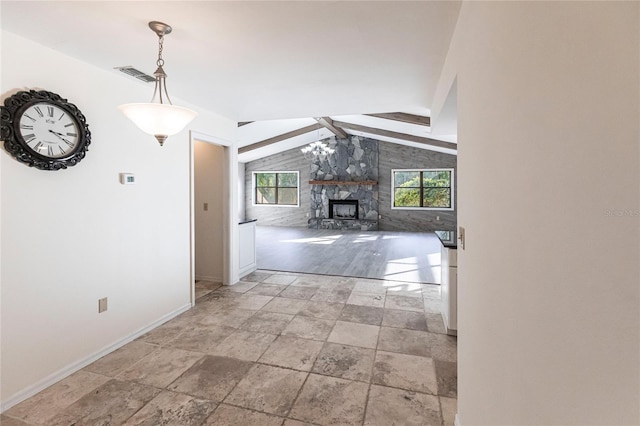 hall featuring lofted ceiling with beams