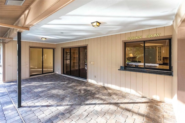 doorway to property featuring a patio