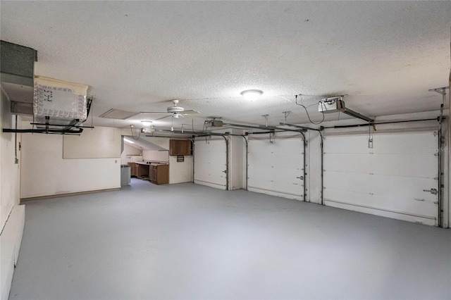 garage with ceiling fan and a garage door opener