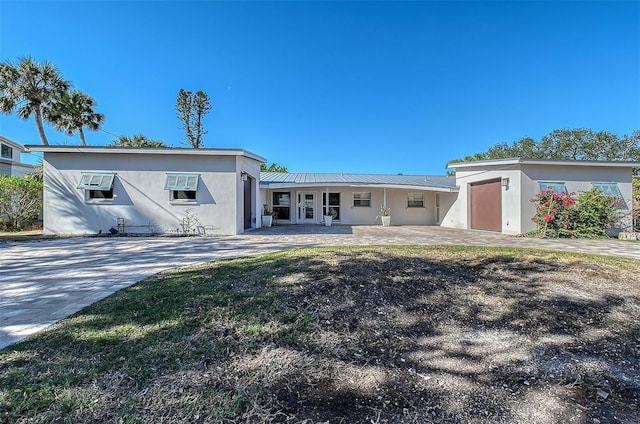 rear view of property featuring french doors