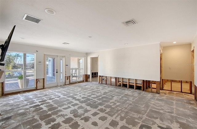 interior space featuring plenty of natural light and crown molding