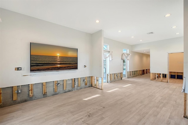 unfurnished living room with light hardwood / wood-style floors