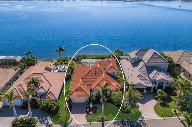 aerial view featuring a water view and a residential view