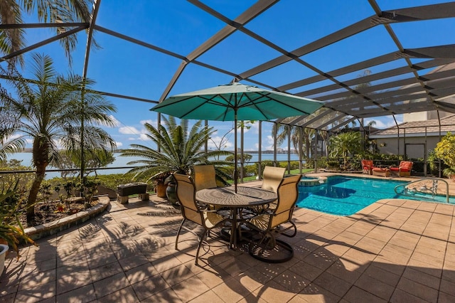 view of swimming pool featuring an in ground hot tub, a lanai, and a patio area