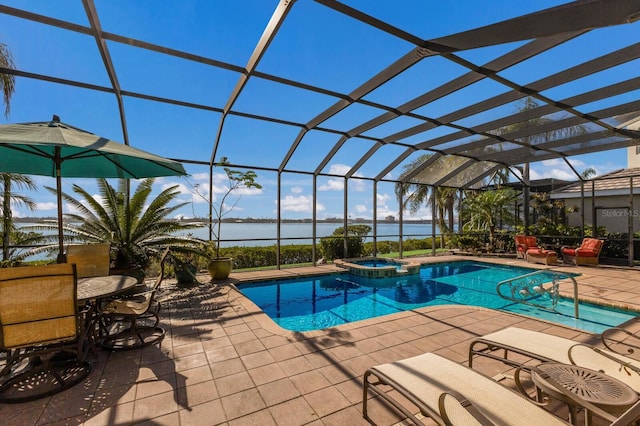 view of swimming pool featuring a lanai, a patio area, a water view, and an in ground hot tub